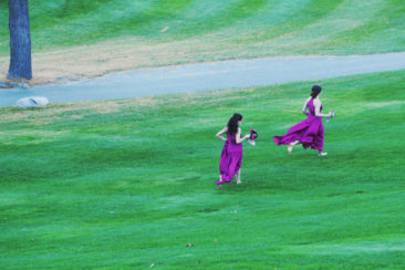 Bridesmaids running at King Valley Golf course. Fall Wedding photography session
